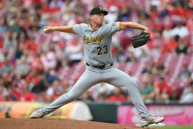 Reds burn Pirates for 10-2 victory